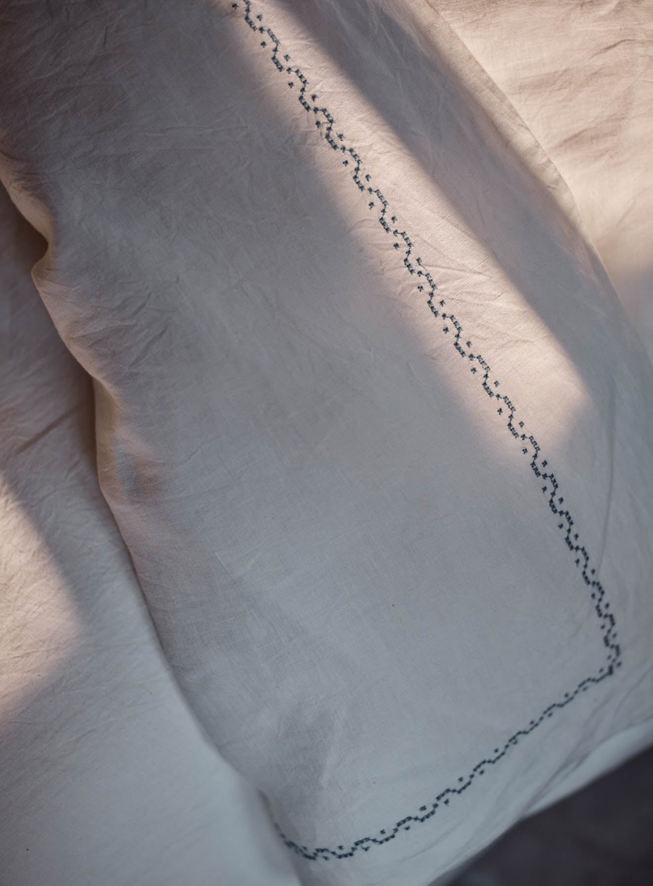 Couette en lin brodé