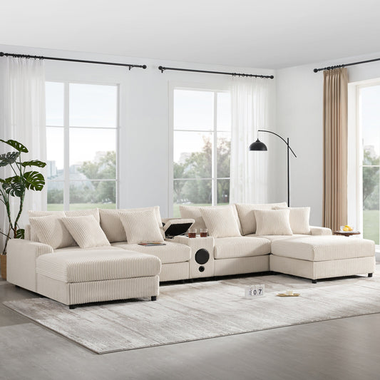 Canapé d'angle en velours côtelé avec haut-parleurs Bluetooth, chargeur USB, porte-gobelets, rangement, pouf, assise profonde et large.