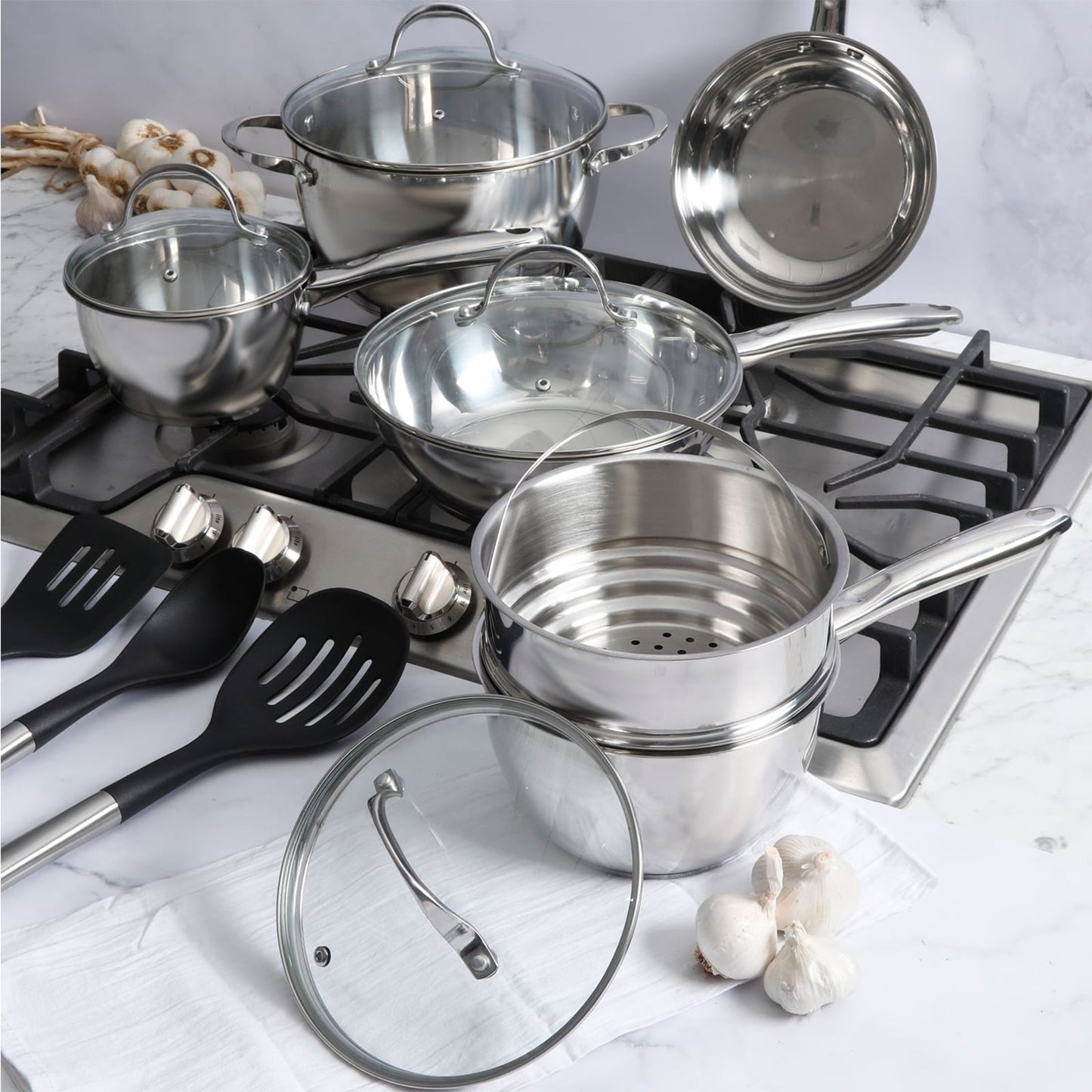 Ensemble de casseroles et poêles Oster Ridgewell en acier inoxydable, 13 pièces, forme bombée.