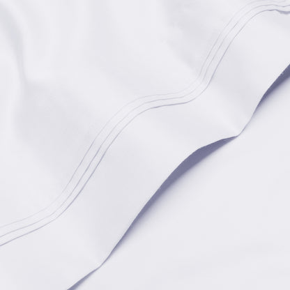 Jeu de draps uni en coton égyptien supérieur, 1000 fils, avec profonde poche.