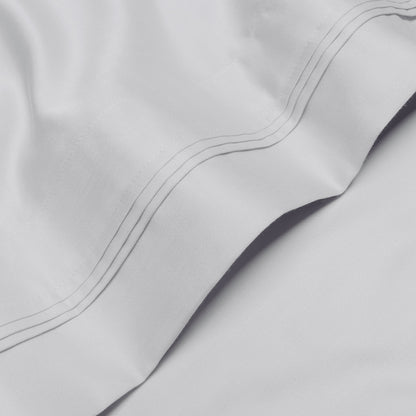 Jeu de draps uni en coton égyptien supérieur, 1000 fils, avec profonde poche.