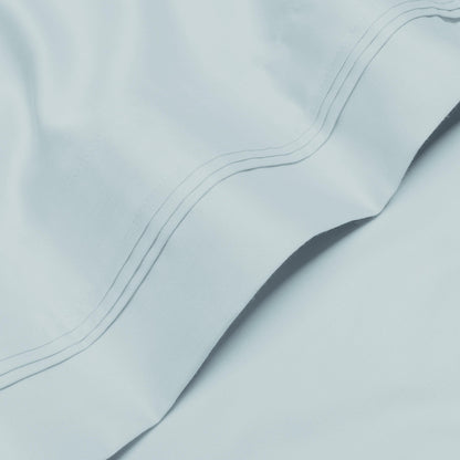 Jeu de draps uni en coton égyptien supérieur, 1000 fils, avec profonde poche.