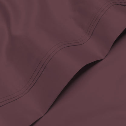 Jeu de draps uni en coton égyptien supérieur, 1000 fils, avec profonde poche.
