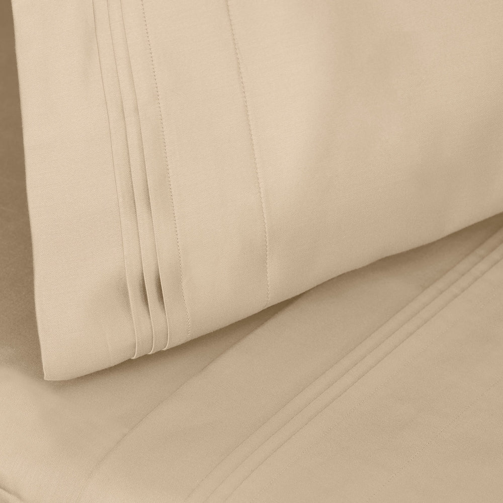 Jeu de draps uni en coton égyptien supérieur, 1000 fils, avec profonde poche.