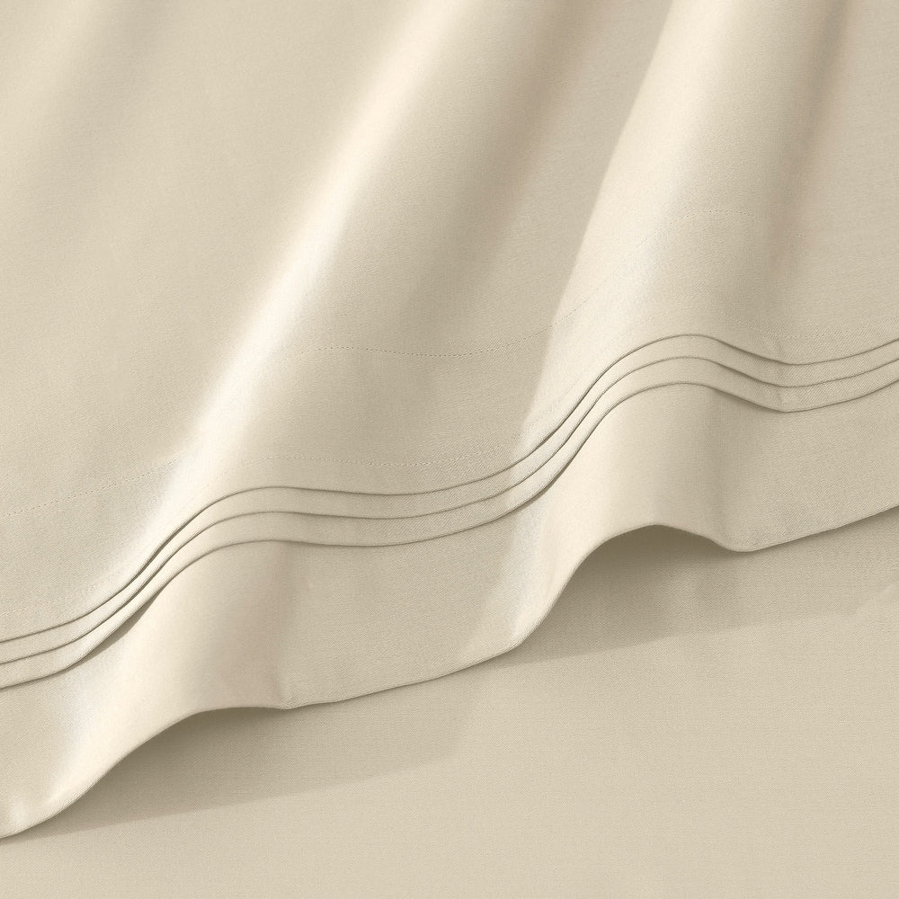 Jeu de draps uni en coton égyptien supérieur, 1000 fils, avec profonde poche.