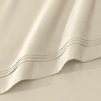Jeu de draps uni en coton égyptien supérieur, 1000 fils, avec profonde poche.