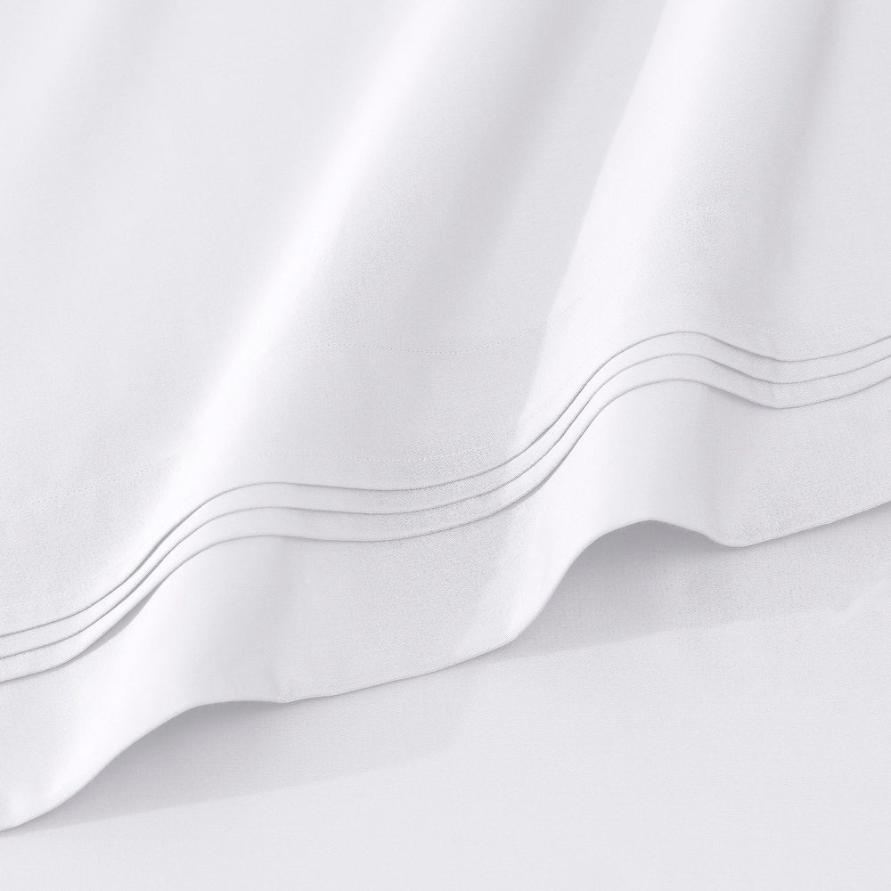 Jeu de draps uni en coton égyptien supérieur, 1000 fils, avec profonde poche.