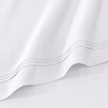 Jeu de draps uni en coton égyptien supérieur, 1000 fils, avec profonde poche.