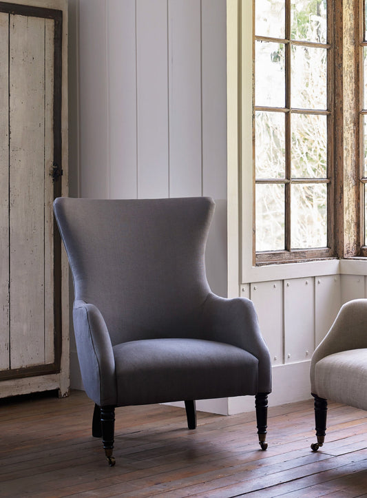 Fauteuil à oreilles Bromley, lin gris (pieds noirs)