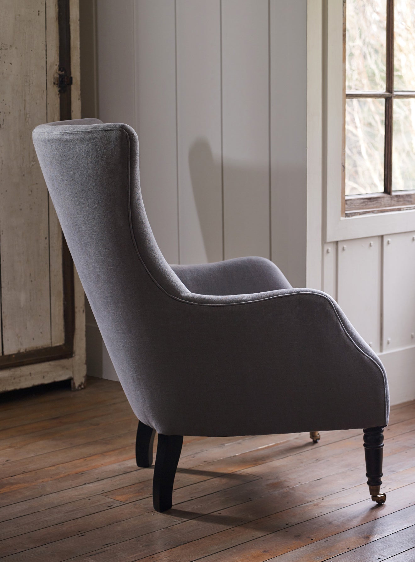 Fauteuil à oreilles Bromley, lin gris (pieds noirs)