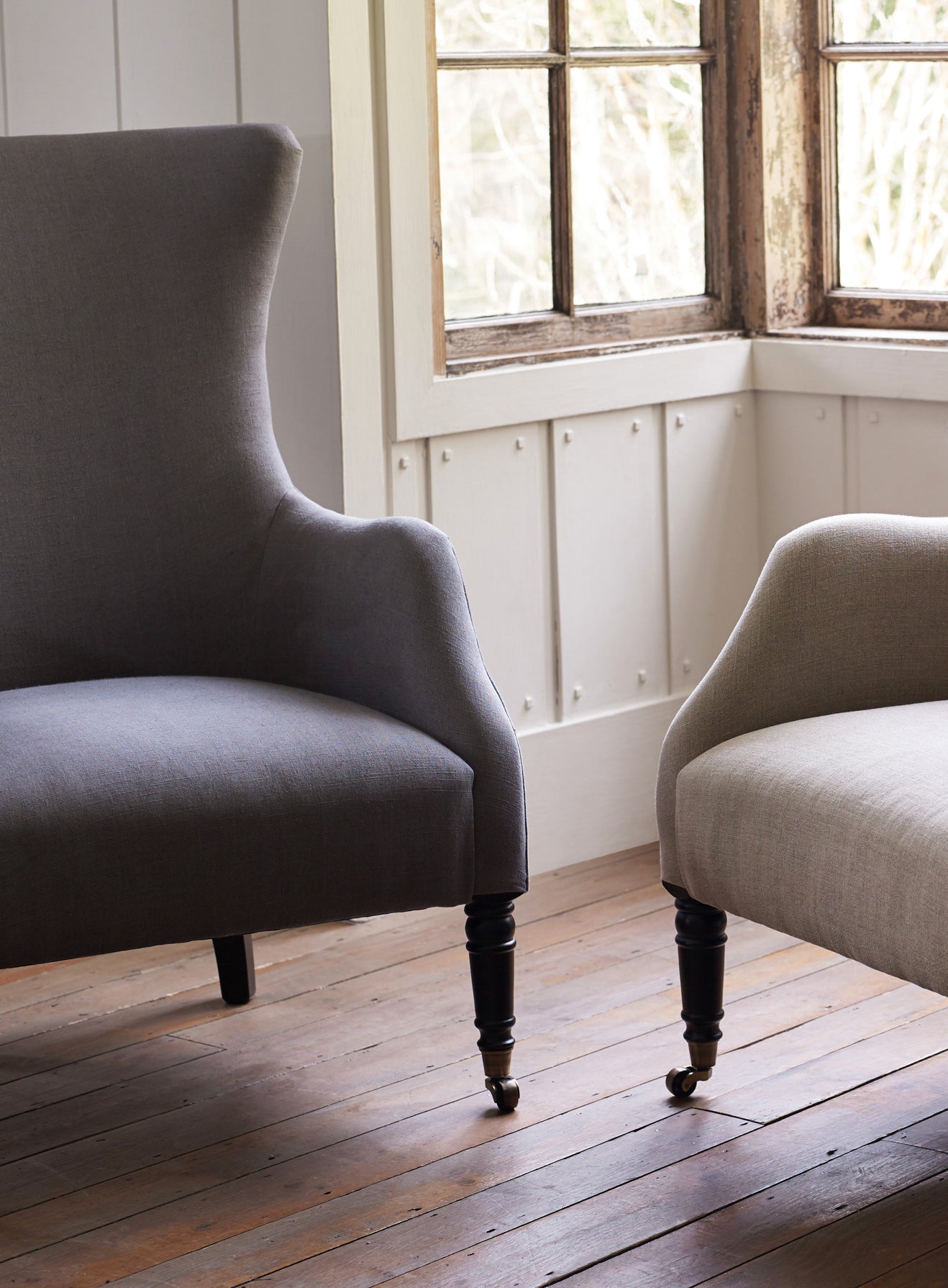 Fauteuil à oreilles Bromley, lin gris (pieds noirs)